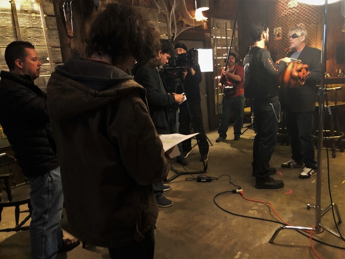Zachary Cook script supervising on the set of &quot;Trick and Treats&quot; with Gary Busey.