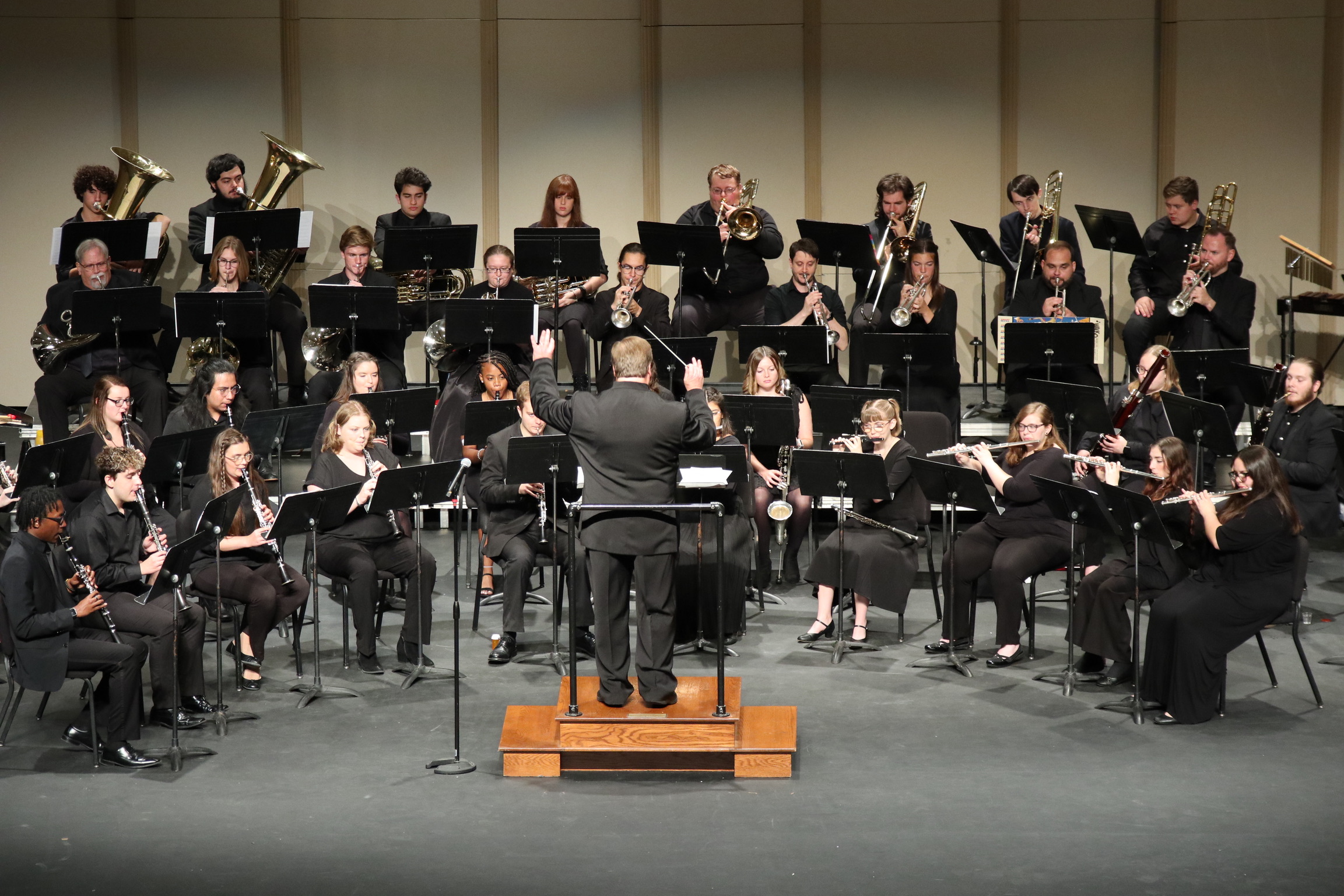 The Millikin Symphonic Wind Ensemble performing on the Kirkland stage.