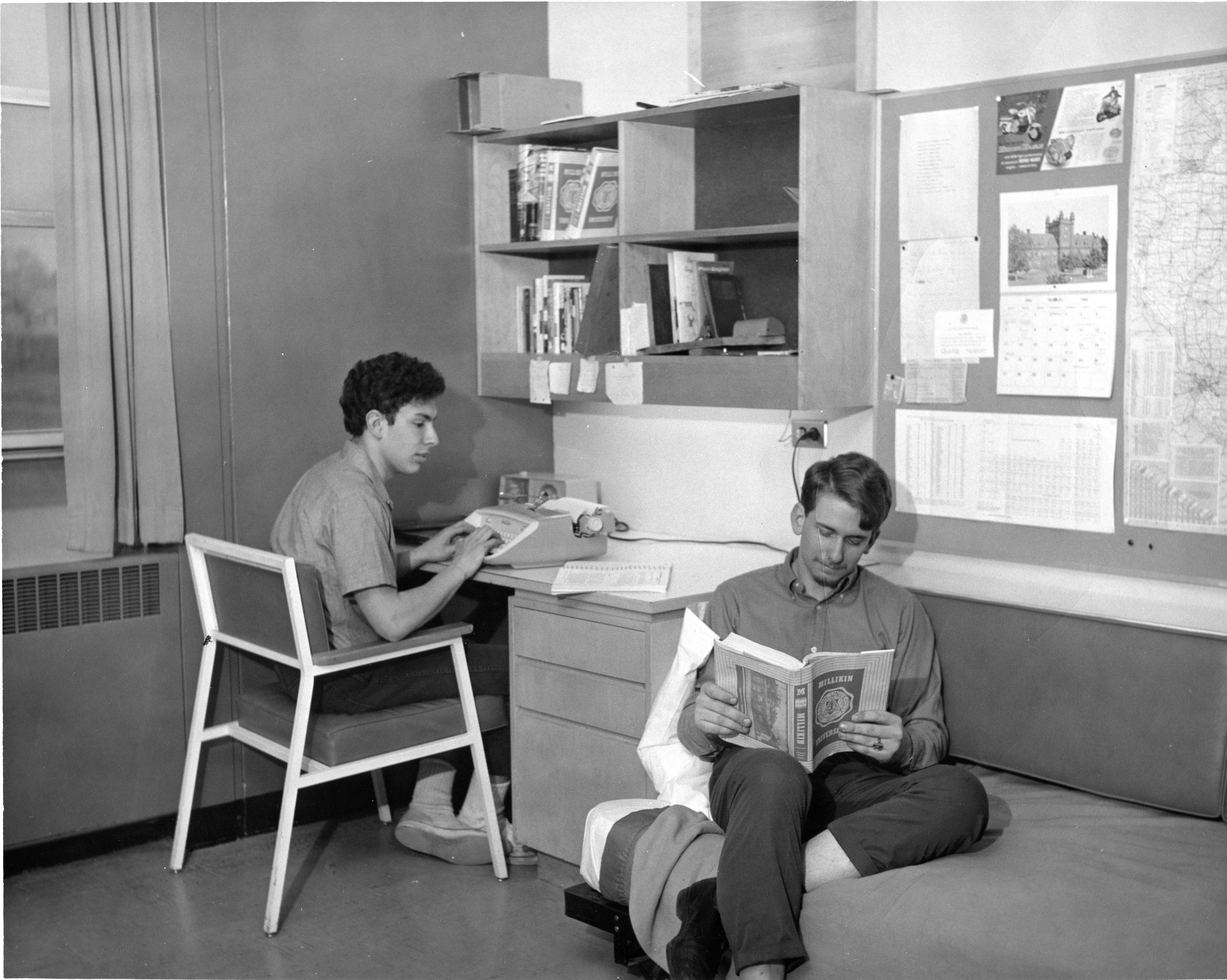 Black and white photo of students in a Mills Hall dorm room