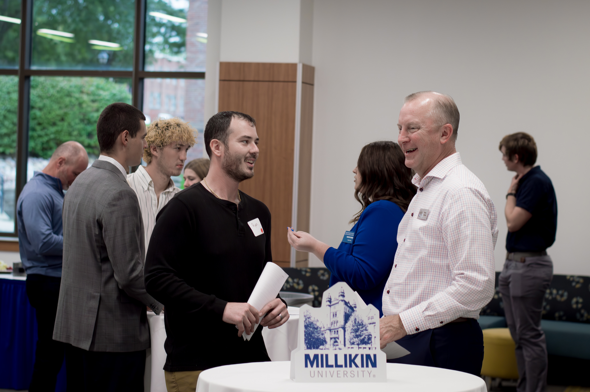 Steve Grohne talking with student