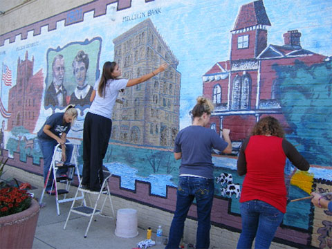 Students painting a mural 