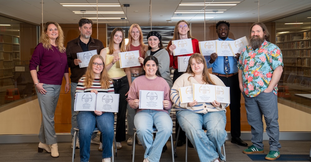 group of art students posing for photo