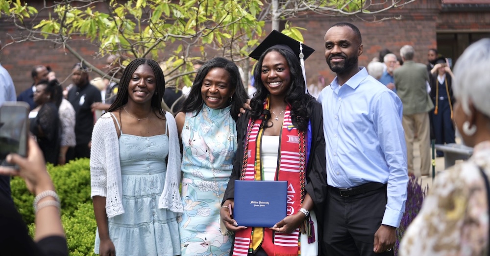 graduating student with family