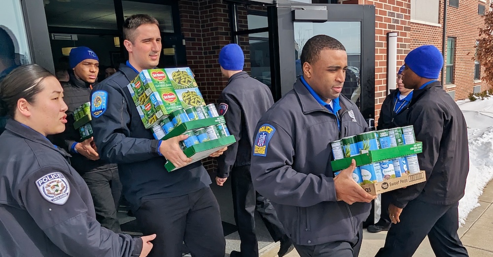 law enforcement cadets carrying food