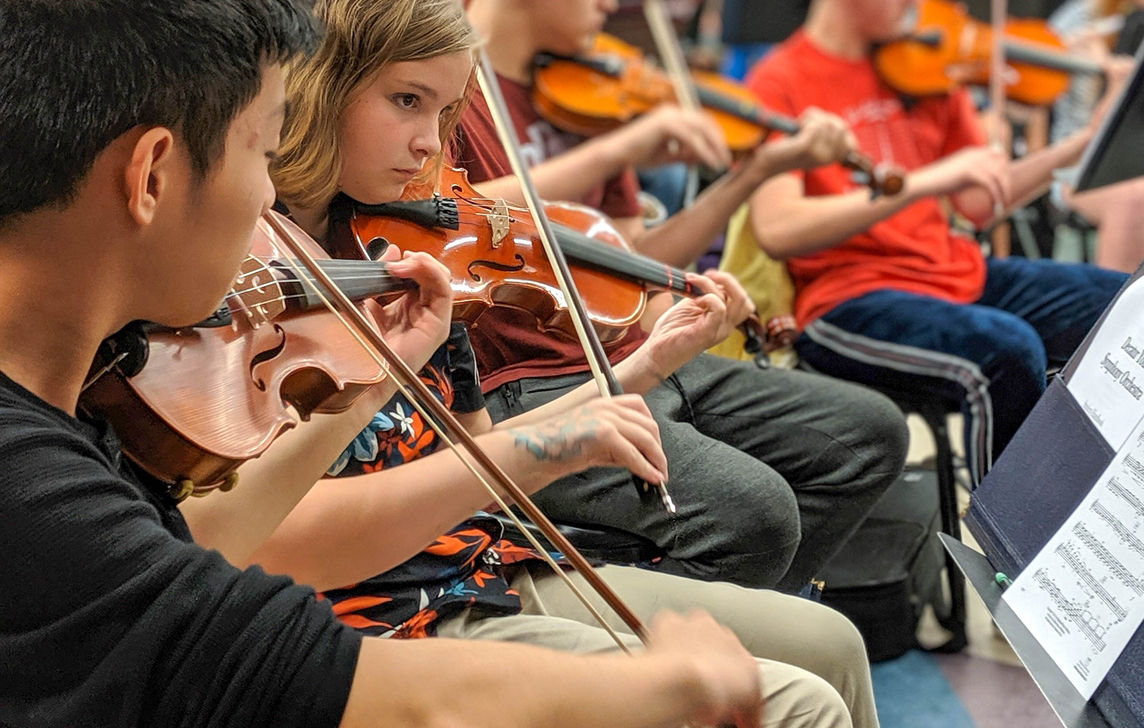 Children playing violin!
