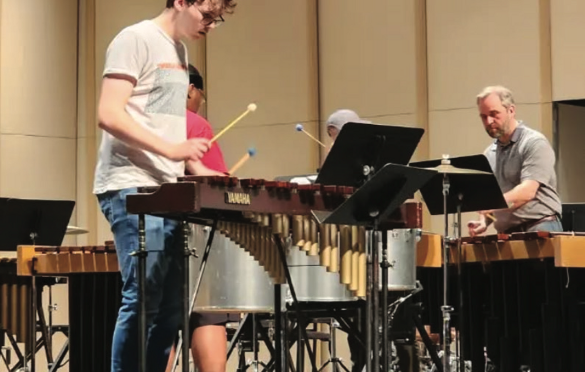 students playing percussion