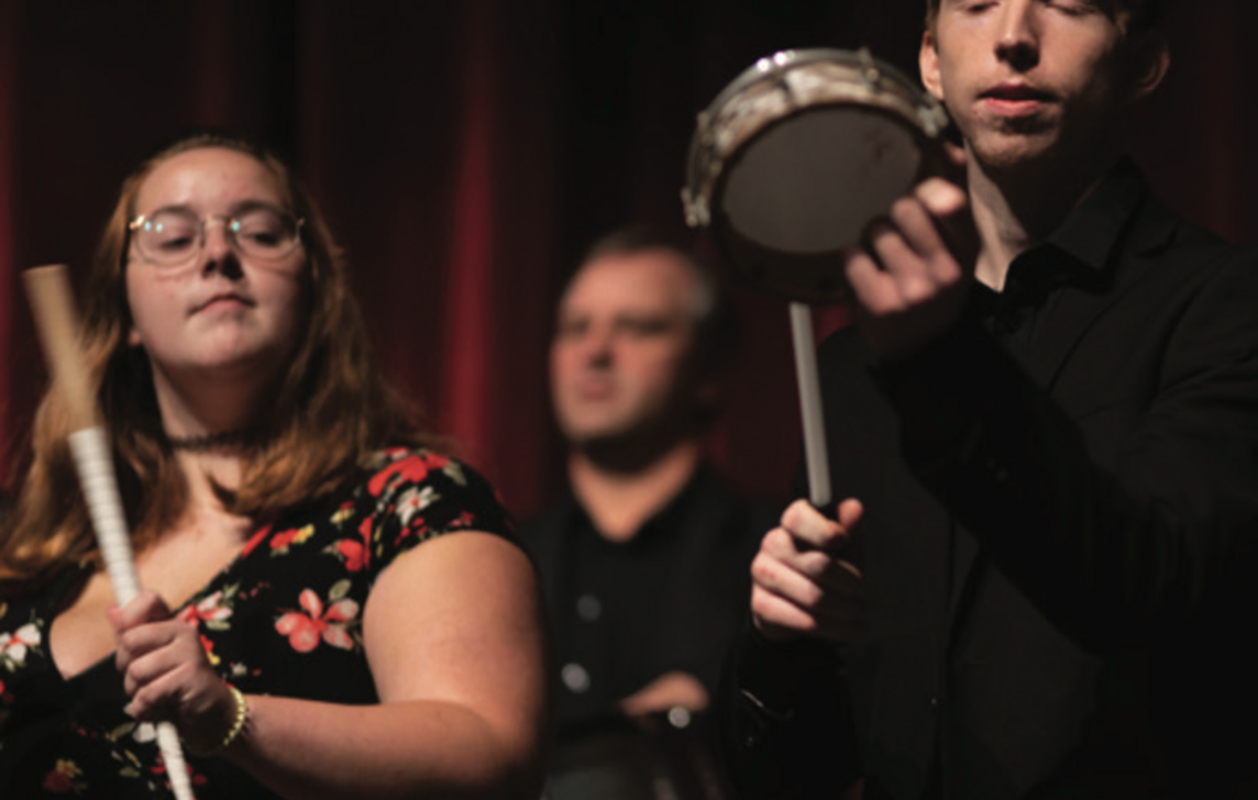 students playing percussion