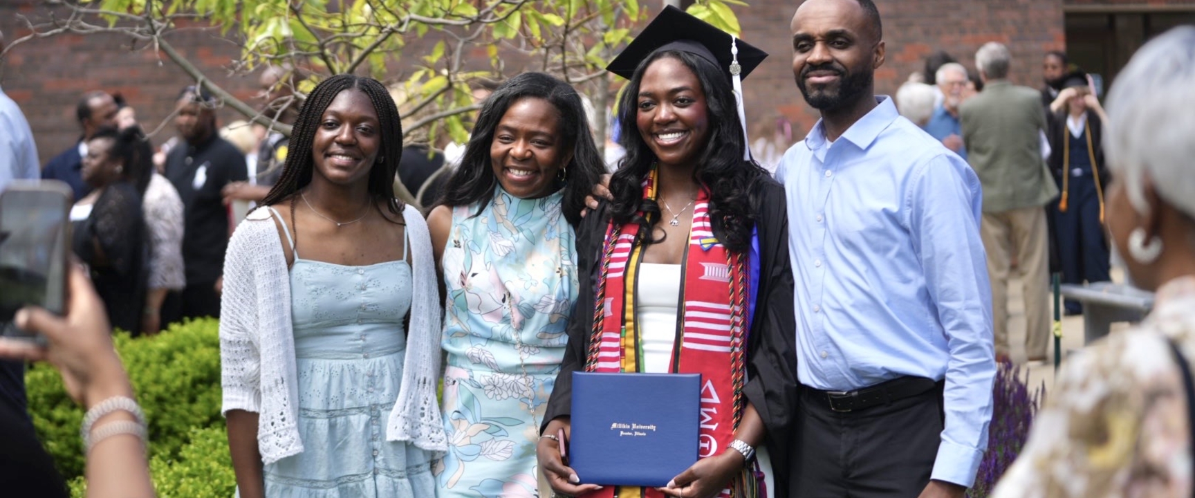 Family after Commencement ceremony with Millikin graduate