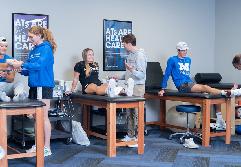 Athletics science students practicing skills 