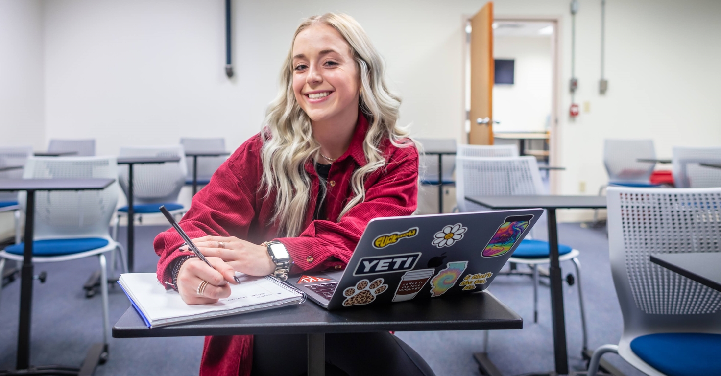 Girl smiling at computer