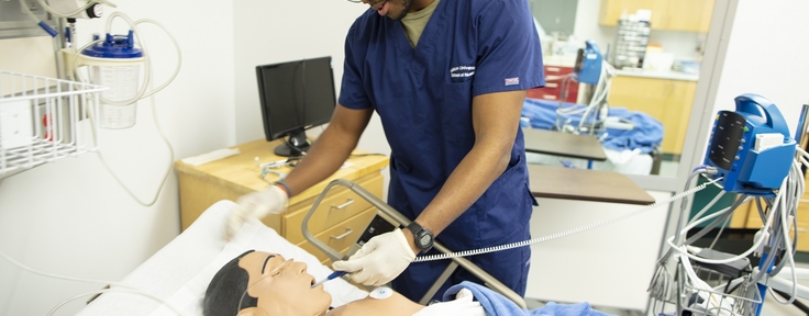 Student testing medical equipment