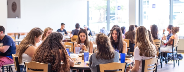 Group of students sitting at a round table