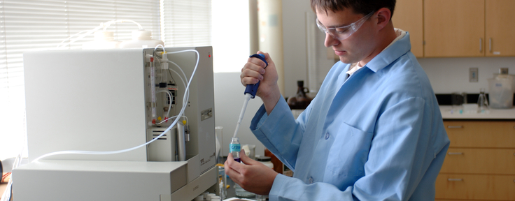 Student with lab equipment