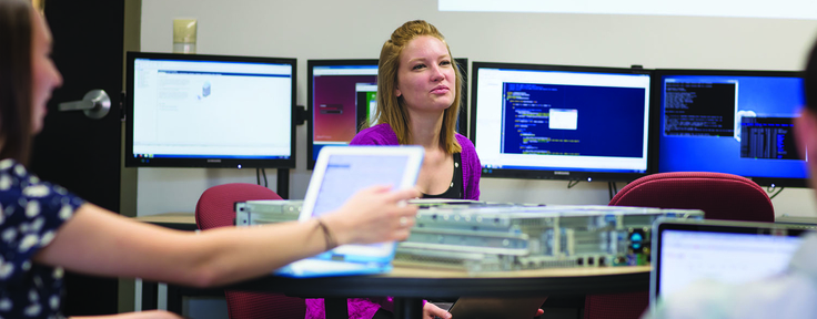 students with computer equipment