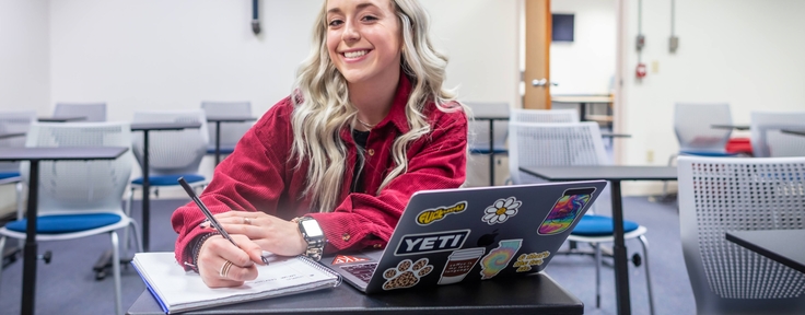 Girl smiling at computer