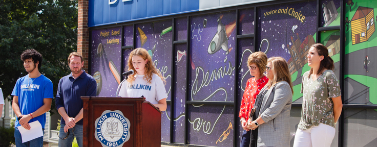 Student at podium speaking