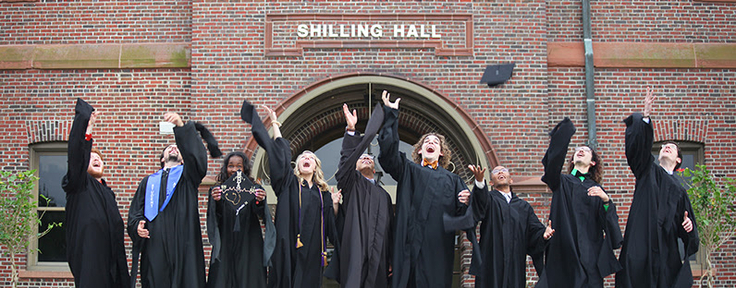Students throwing caps in the air
