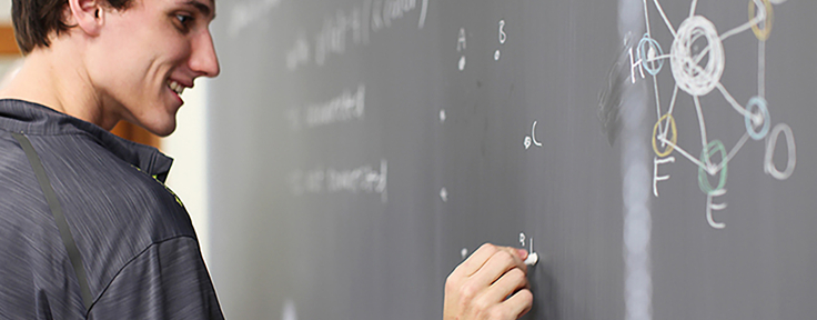 student writing equation