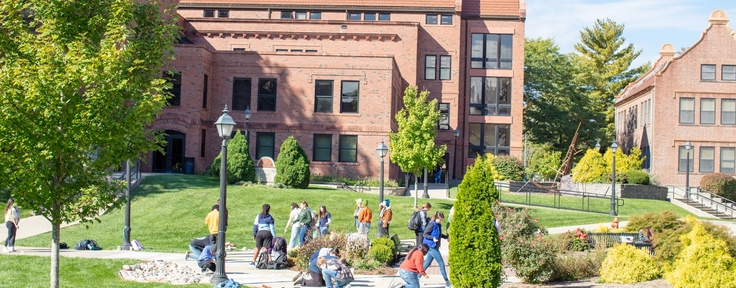 Students chalking sidewalk