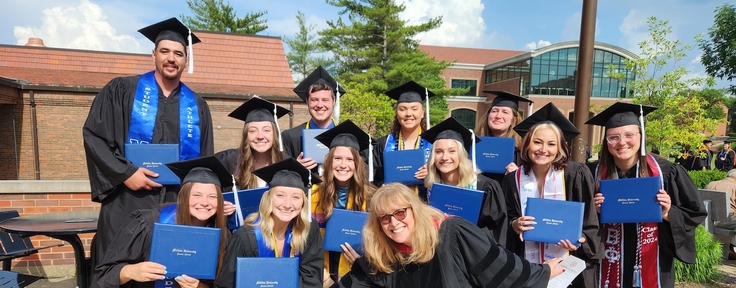 graduating students smiling