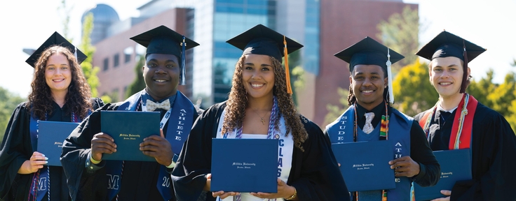 Graduates with diplomas