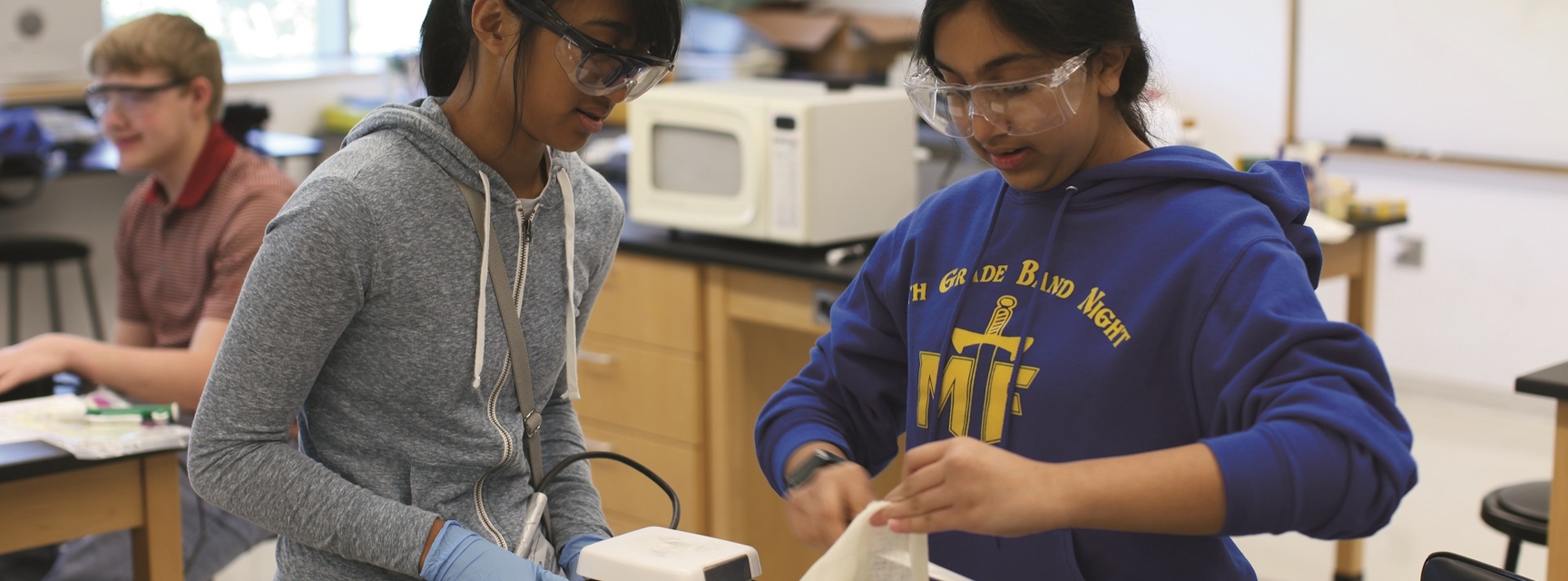 two chemistry students working in a lab