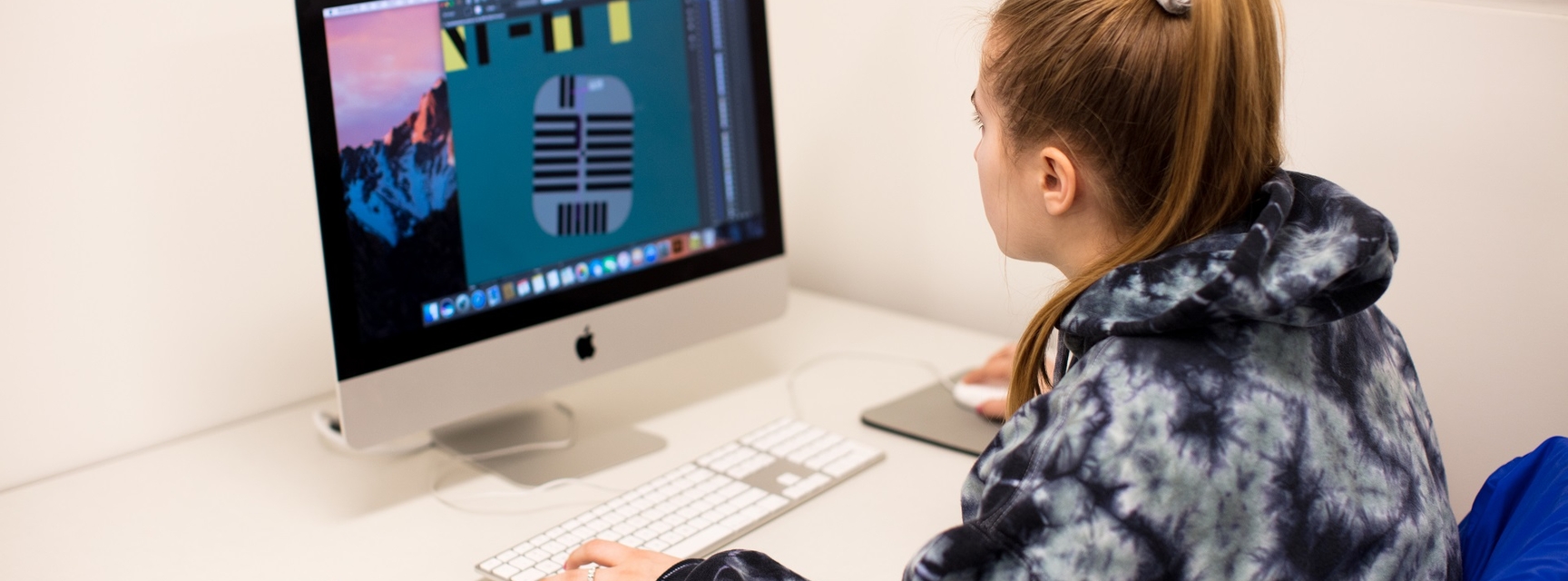 student editing an image on computer