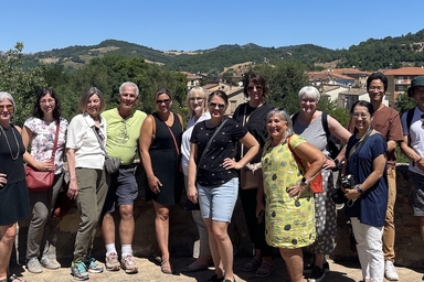 people standing for group photo italy countryside