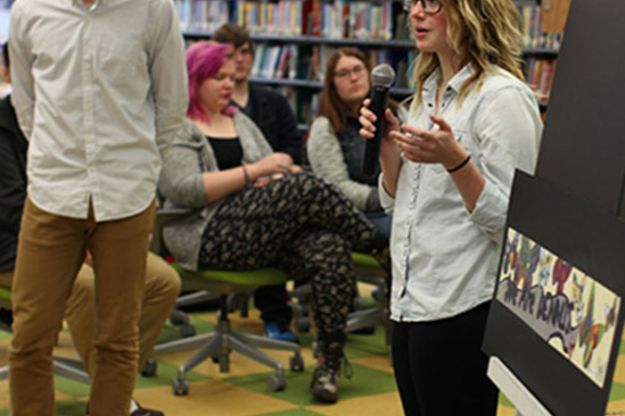 student speaking into microphone