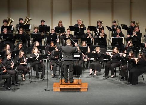 The Millikin Symphonic Wind Ensemble performing on the Kirkland stage.