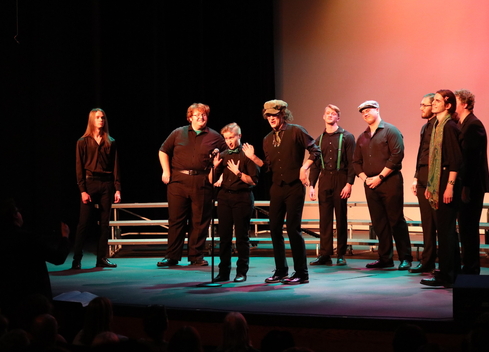 Students sing classic Irish songs on stage in Albert Taylor Theatre