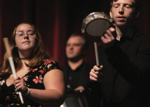 students playing percussion