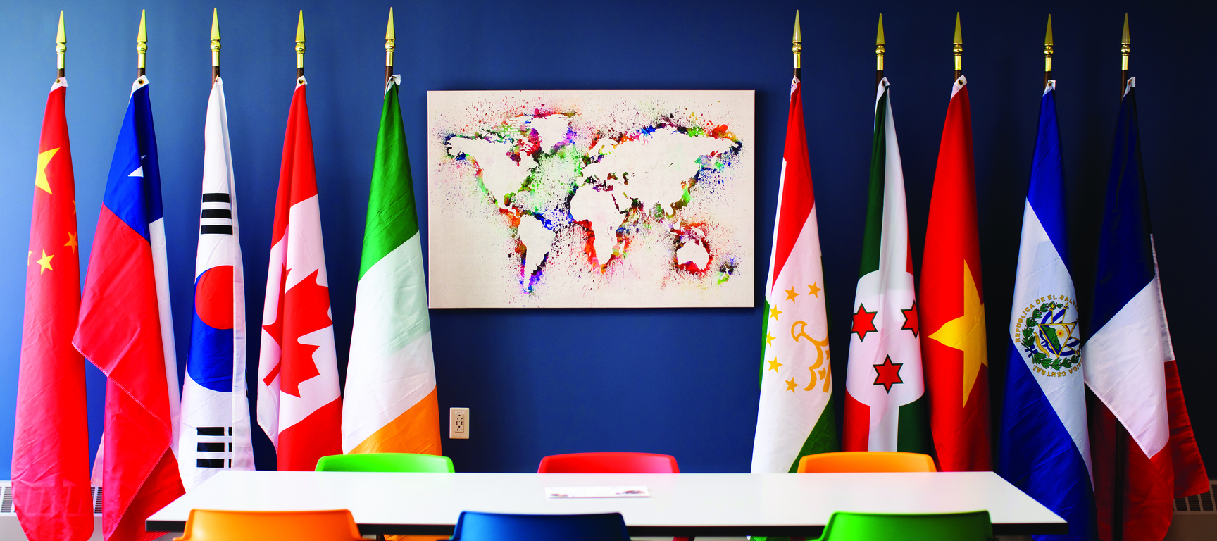 International flags next to a map of the world