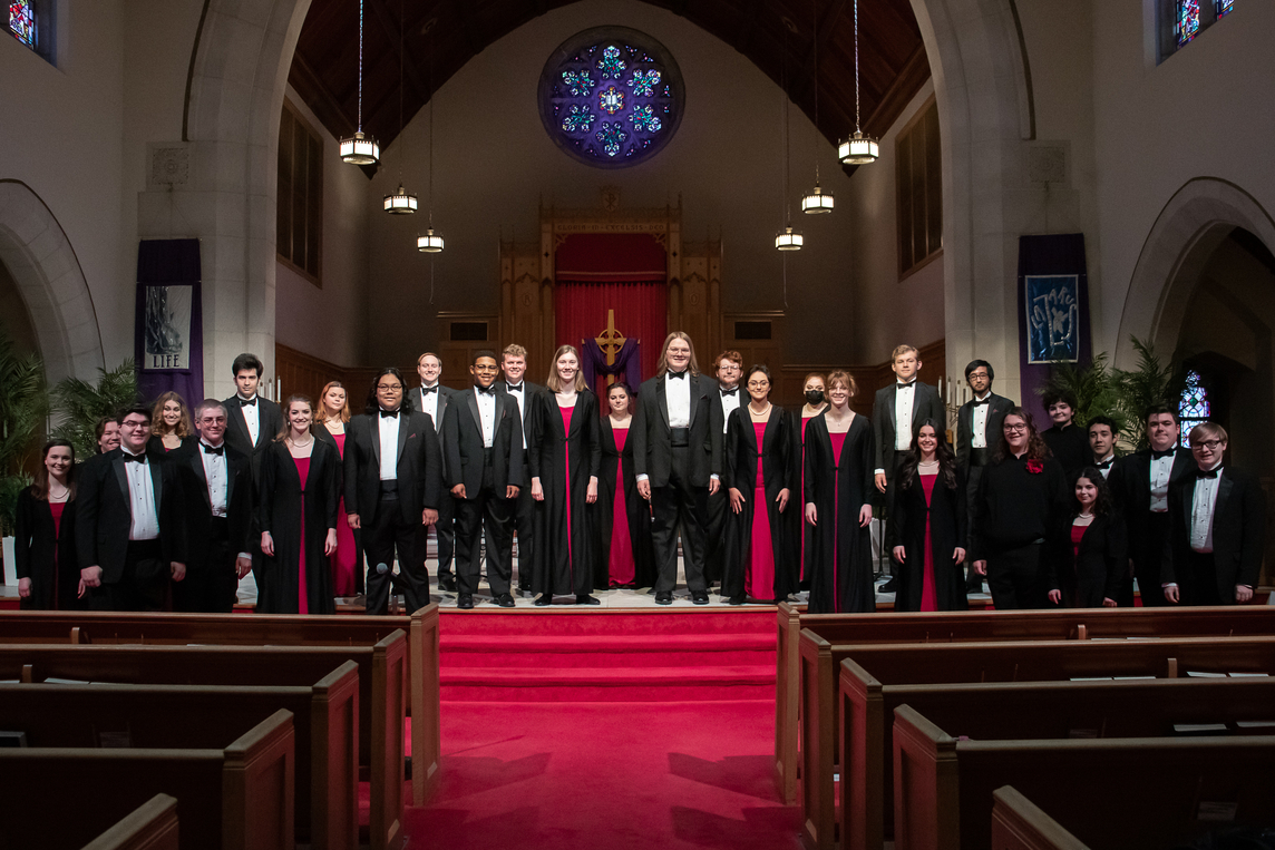 The University Choir poses on the chancel of Central Christian Church.