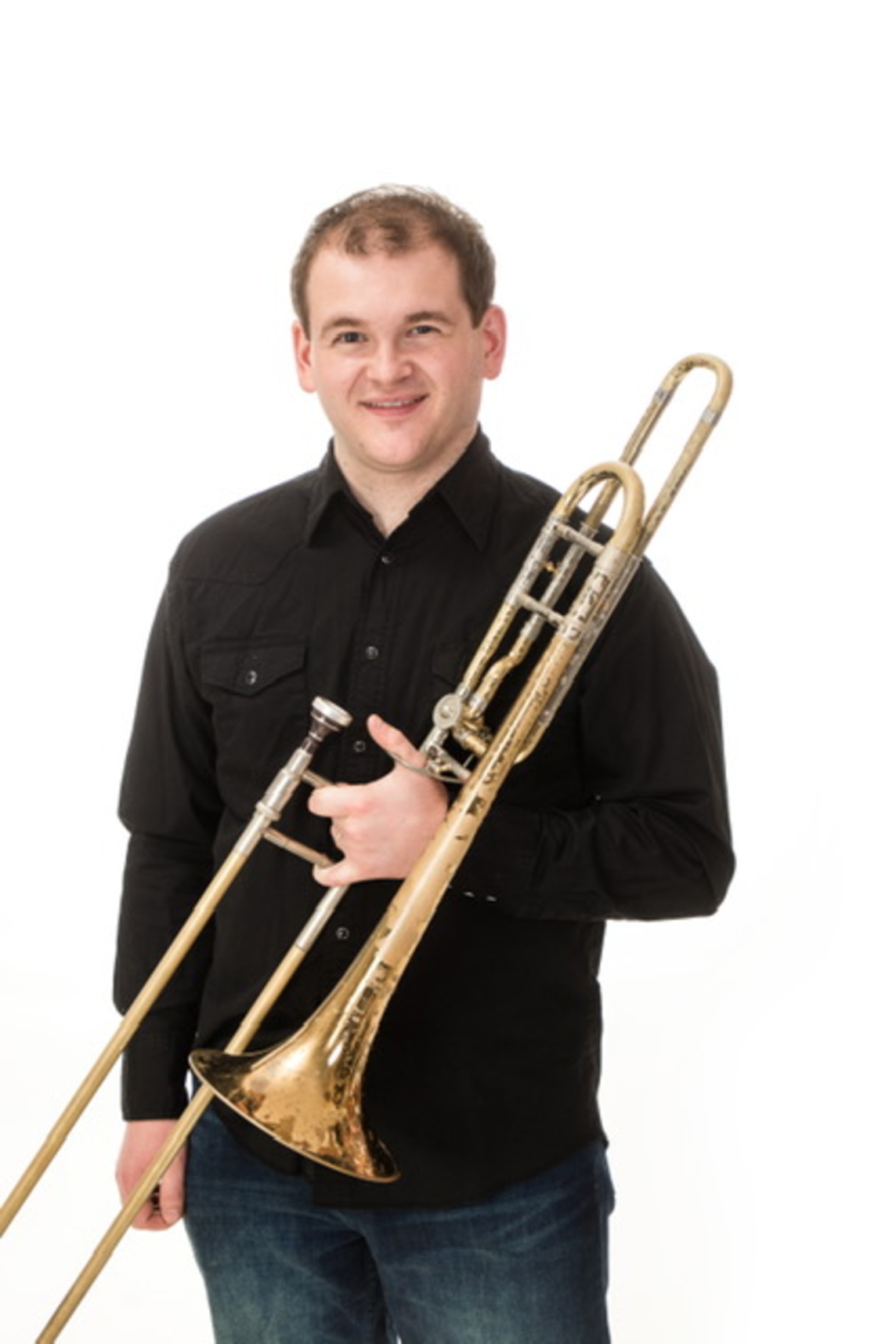 Ryan Christian holding a trombone