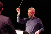 Professor Jeremy Brunk conducts the Millikin Percussion Ensemble. 