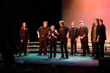 Students sing classic Irish songs on stage in Albert Taylor Theatre