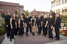 The singing group OneVoice poses on Millikin&#039;s campus.