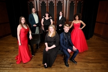 Student members of the Millikin Opera Gala pose on the stage of Kaeuper Hall